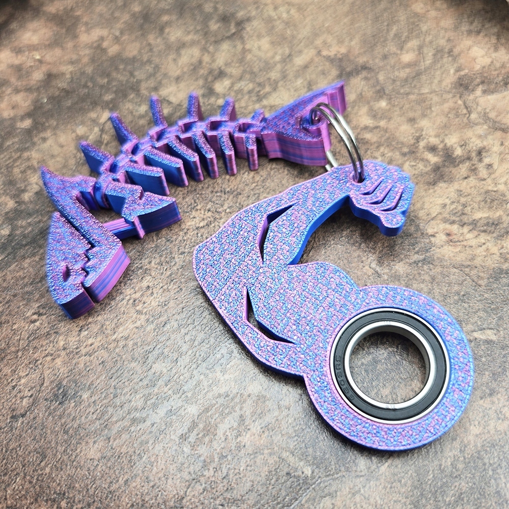 Brelok KeySpinner Siłacz BICEPS + Rekinek HIT Tik Toka Keyrambit Wiek dziecka 10 lat +