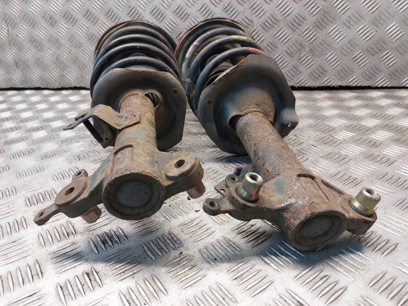 shock absorber spring left front right front NISSAN PRIMERA P12