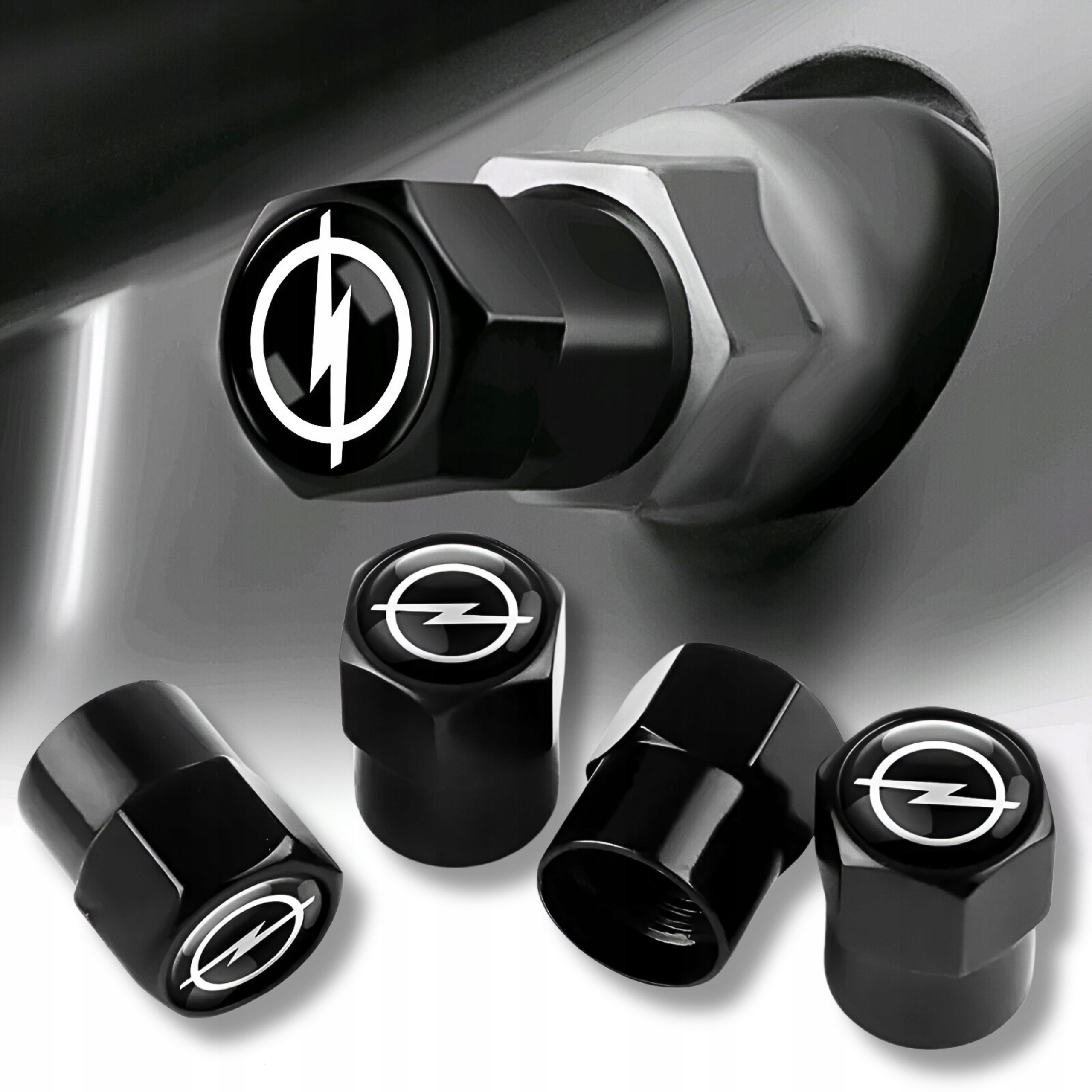 NAKRĘTKI NA WENTYLE OPEL LOGO CZARNE METALOWE KAPTURKI KOMPLET 4 SZT