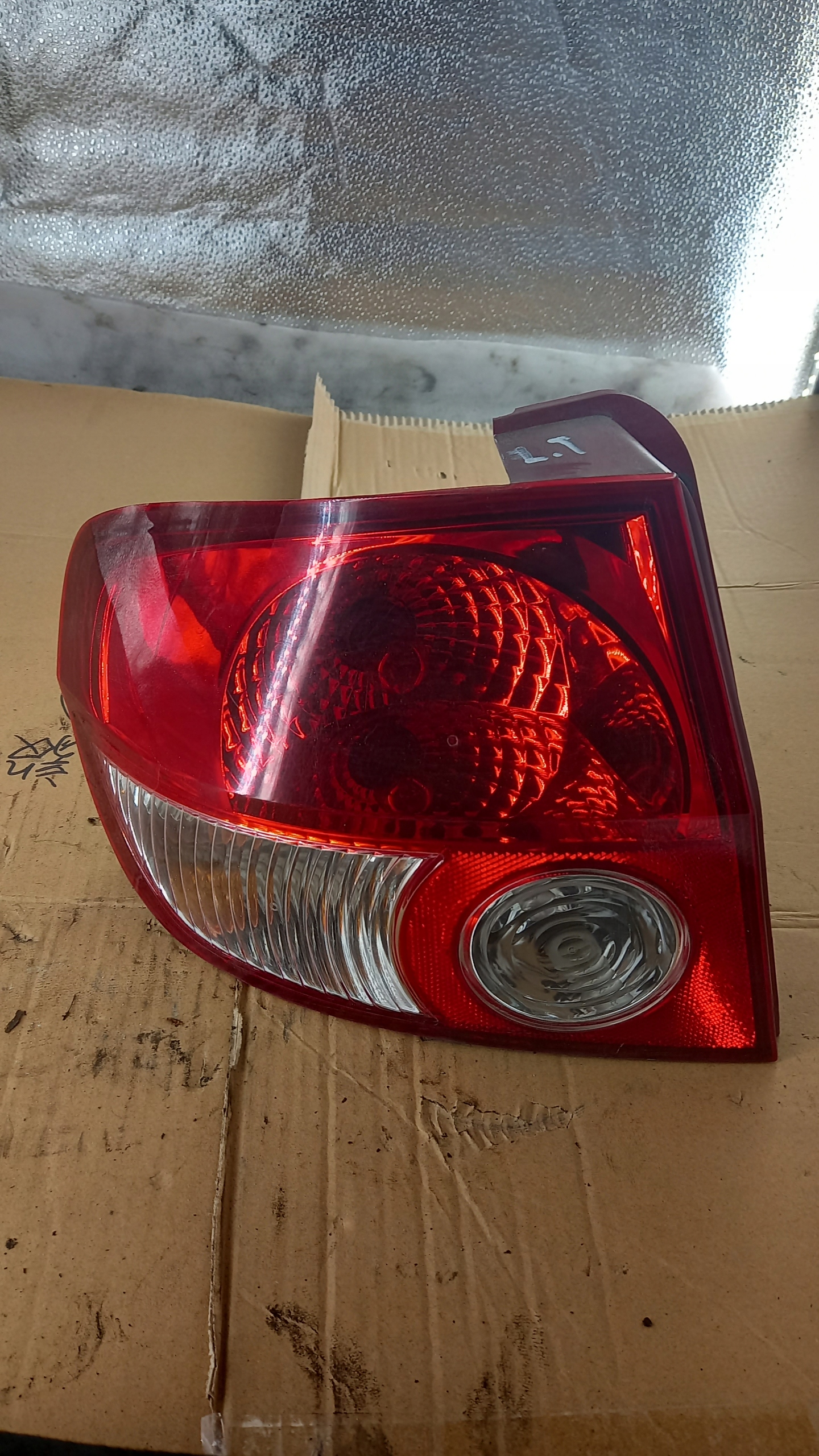 фонарь левый Hyundai GETZ 1.4b 03R HB