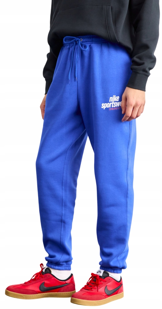 Kalhoty Nike Bavlněné pánské sportovní tepláky s kapsami Loose Fit Teplákovka