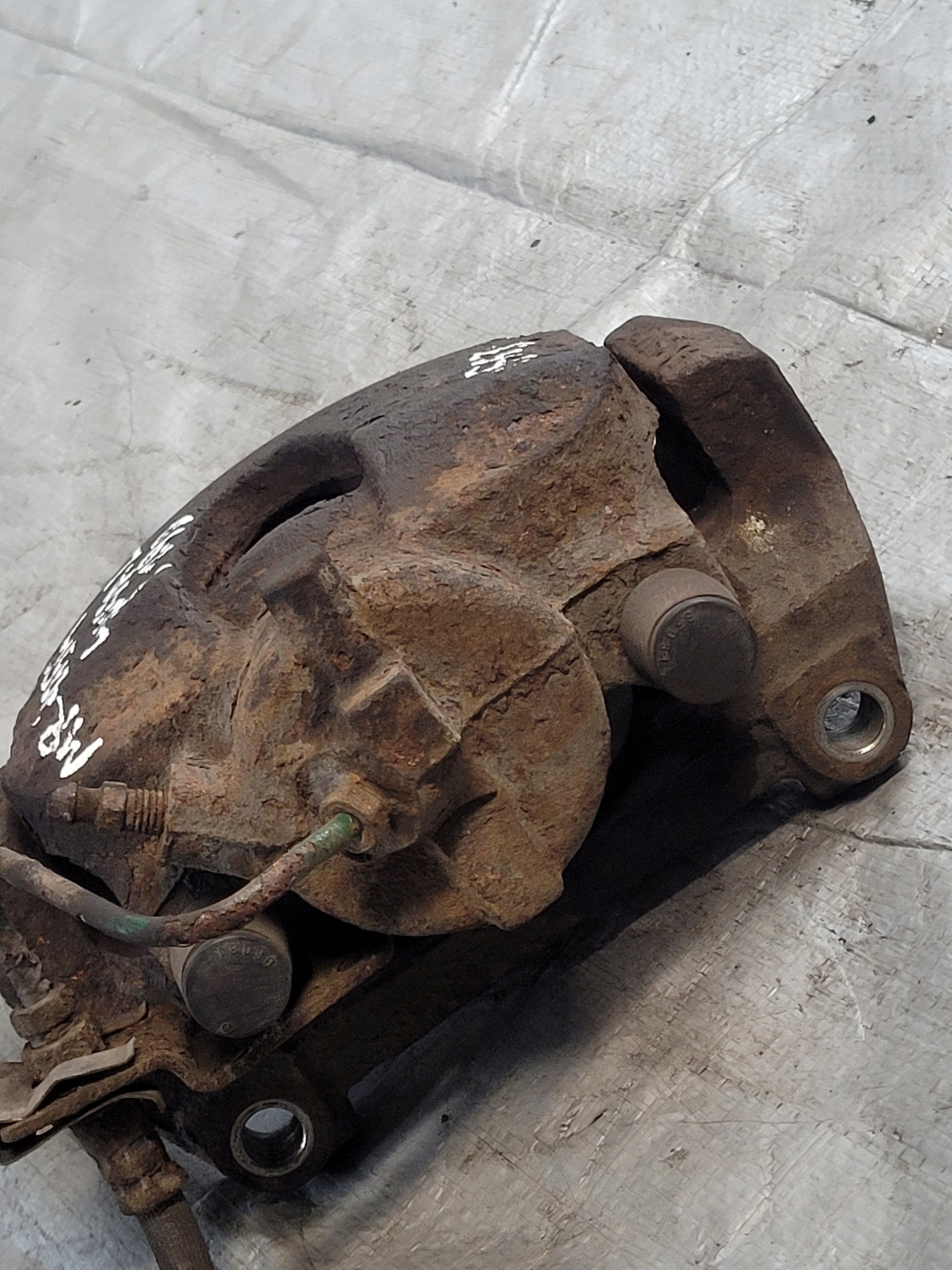 caliper brake left front + caliper carrier RENAULT LAGUNA II 1.9 DCI 02r.