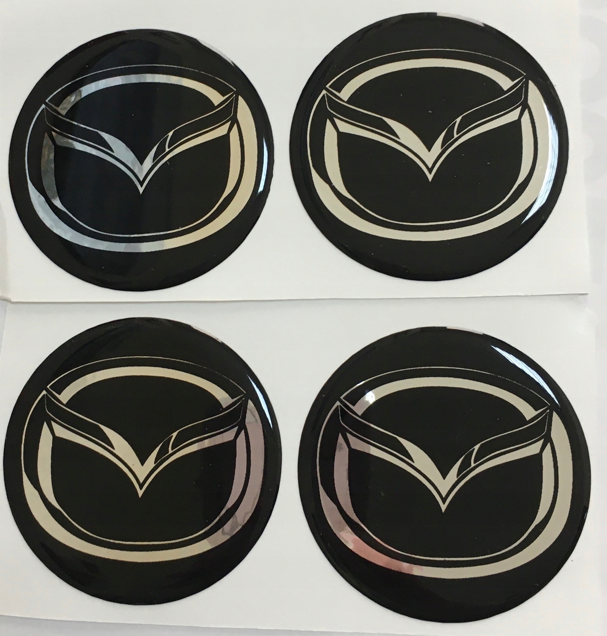

Emblematy Na Kołpaki Felgi 56mm Mazda (zamiennik)