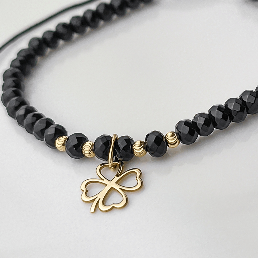 Zlatý náramek na provázku s onyxovými korálky s koničinkou, ryzost 585