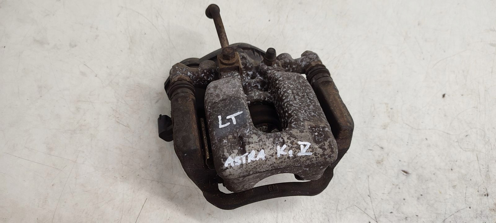 caliper rear part rear left Opel Astra K LIFT 1,5 CDTI