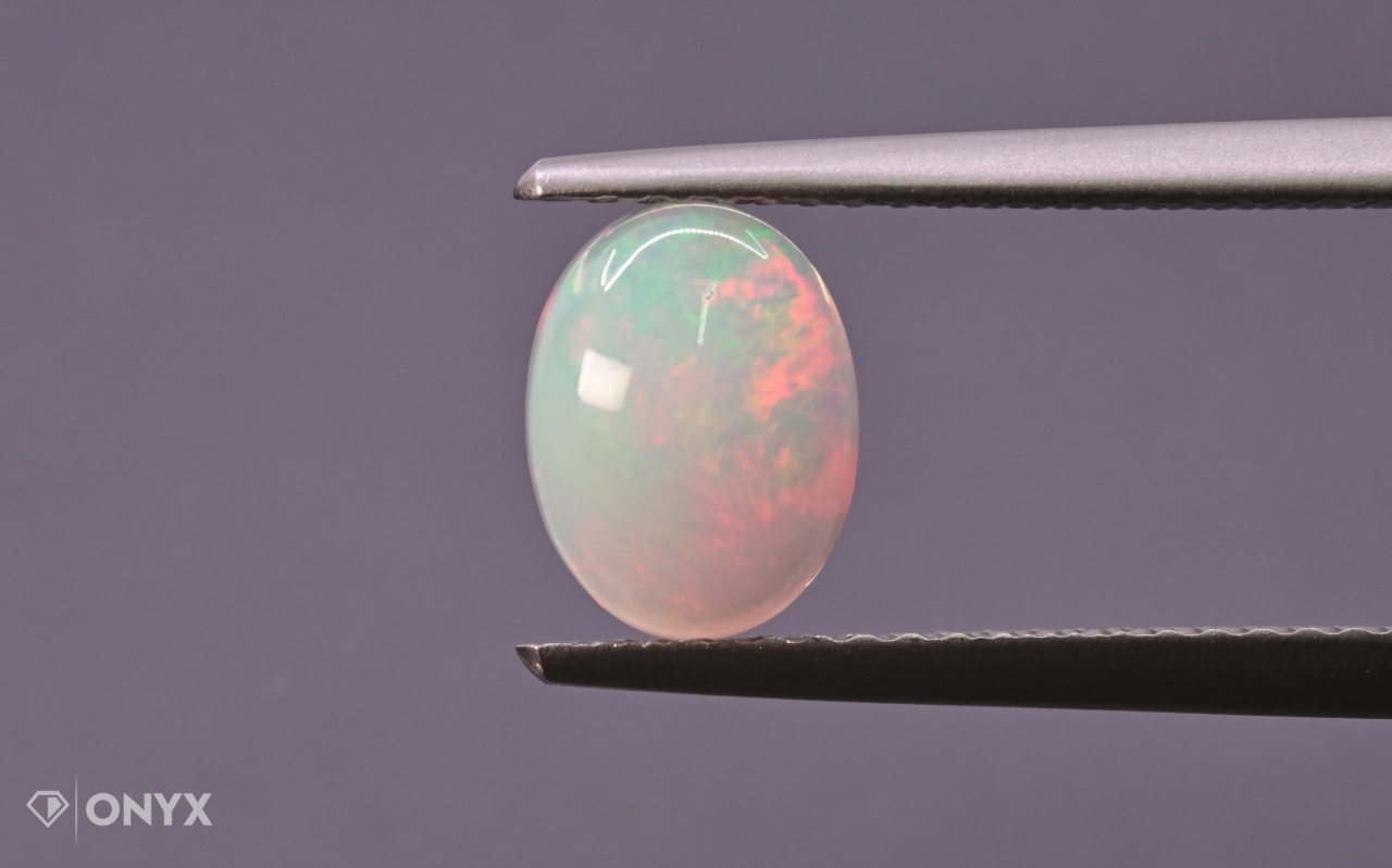 Opál z Etiopie kabošon ovál 8x6 mm