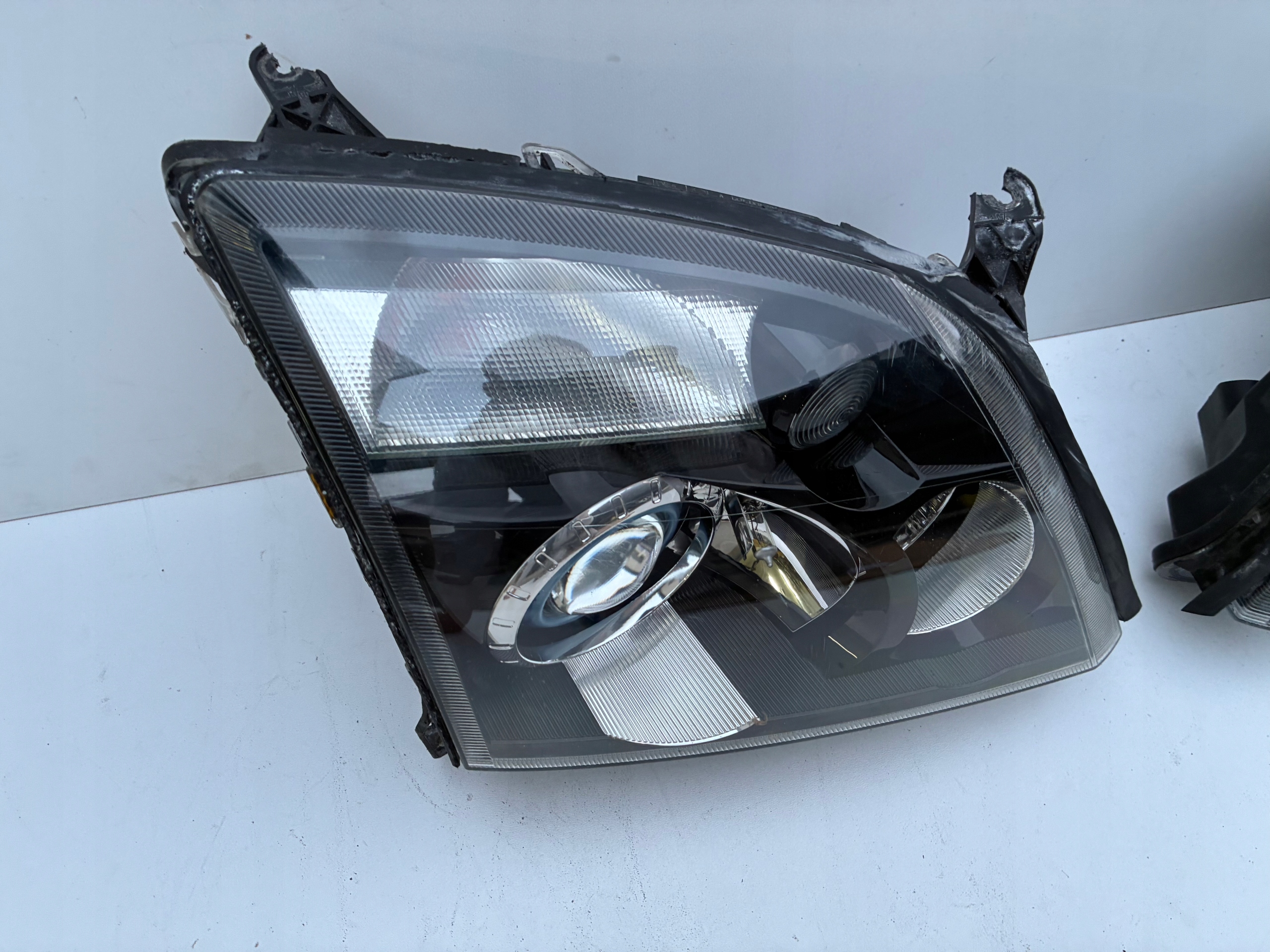 Reflektor light right left front Xenon positioning Opel VECTRA C 02-05r. OEM EU