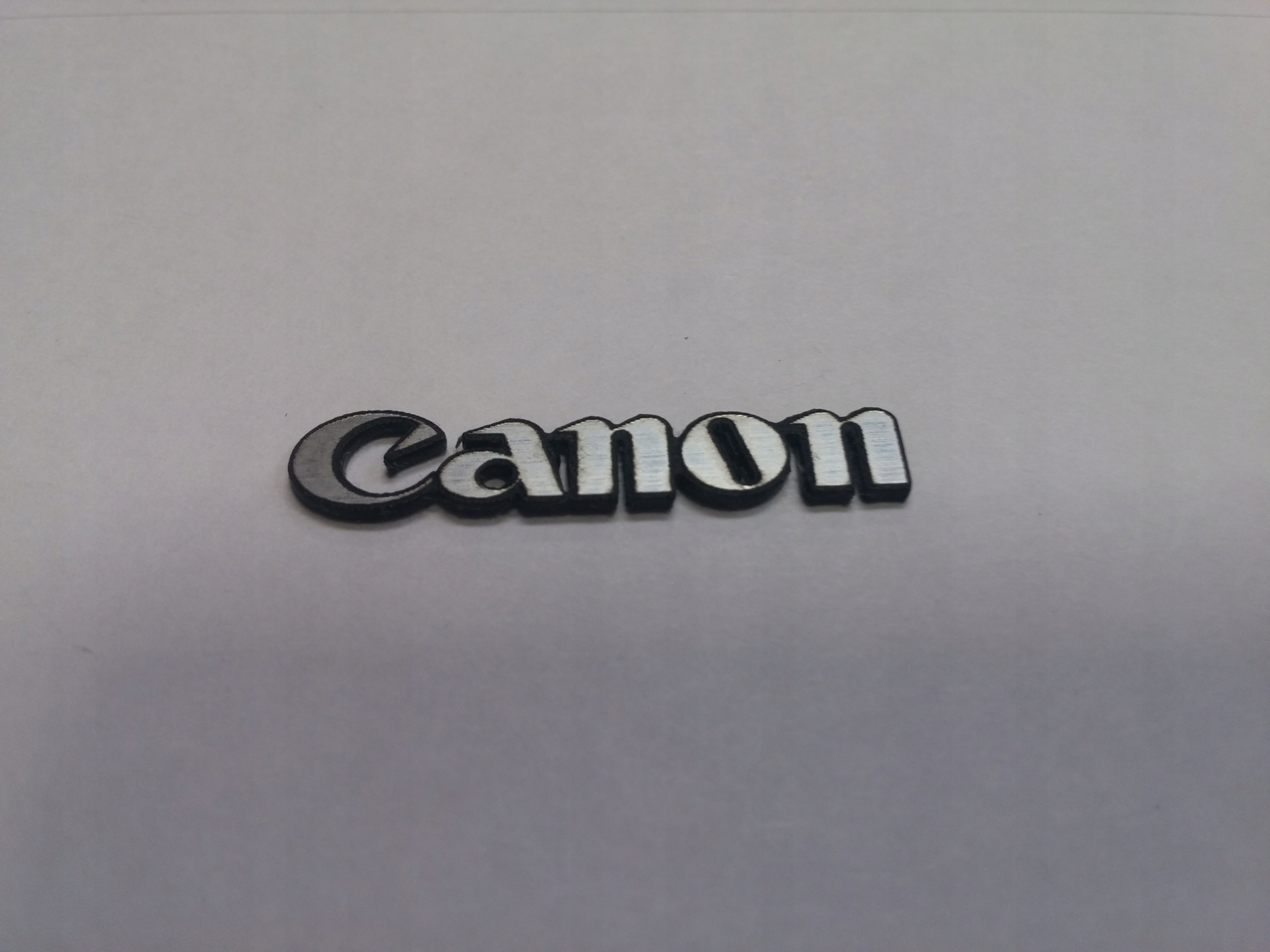

Canon naklejka emblemat 25 x 5 mm *srebrna