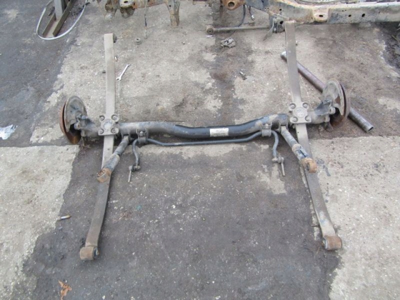 VW CADDY 3 2K SA BELKA ZAWIESZENIA TYŁ + RESORY