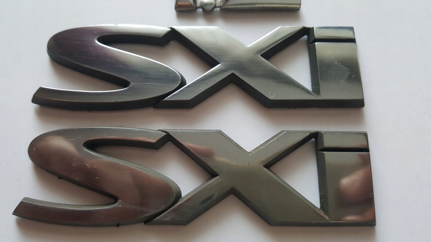 OPEL CORSA C SXI EMBLEMAT ZNACZEK NA DRZWI,BŁOTNIK