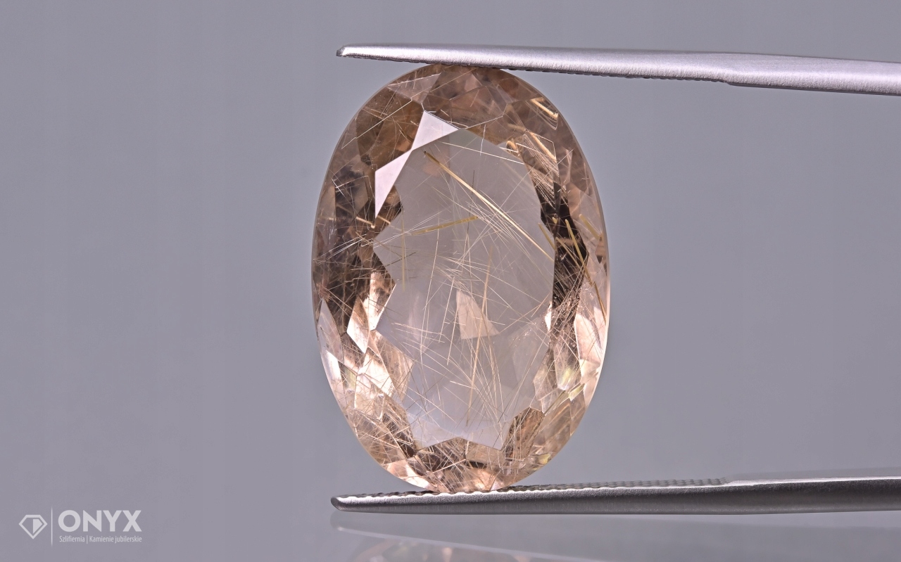 Křemen s rutilem fazetovaný ovál 22,5x15,5 mm