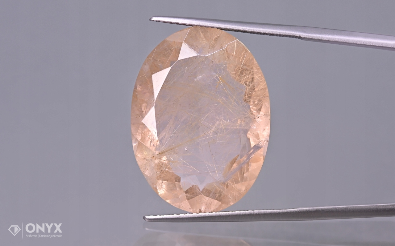 Křemen s rutilem fazetovaný ovál 24,5x18,5 mm