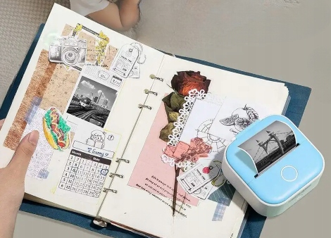 MINI DRUKARKA TERMICZNA PRZENOŚNA do NAKLEJEK ZDJĘĆ NOTATEK PHOMEMO T02 BT Stan opakowania oryginalne