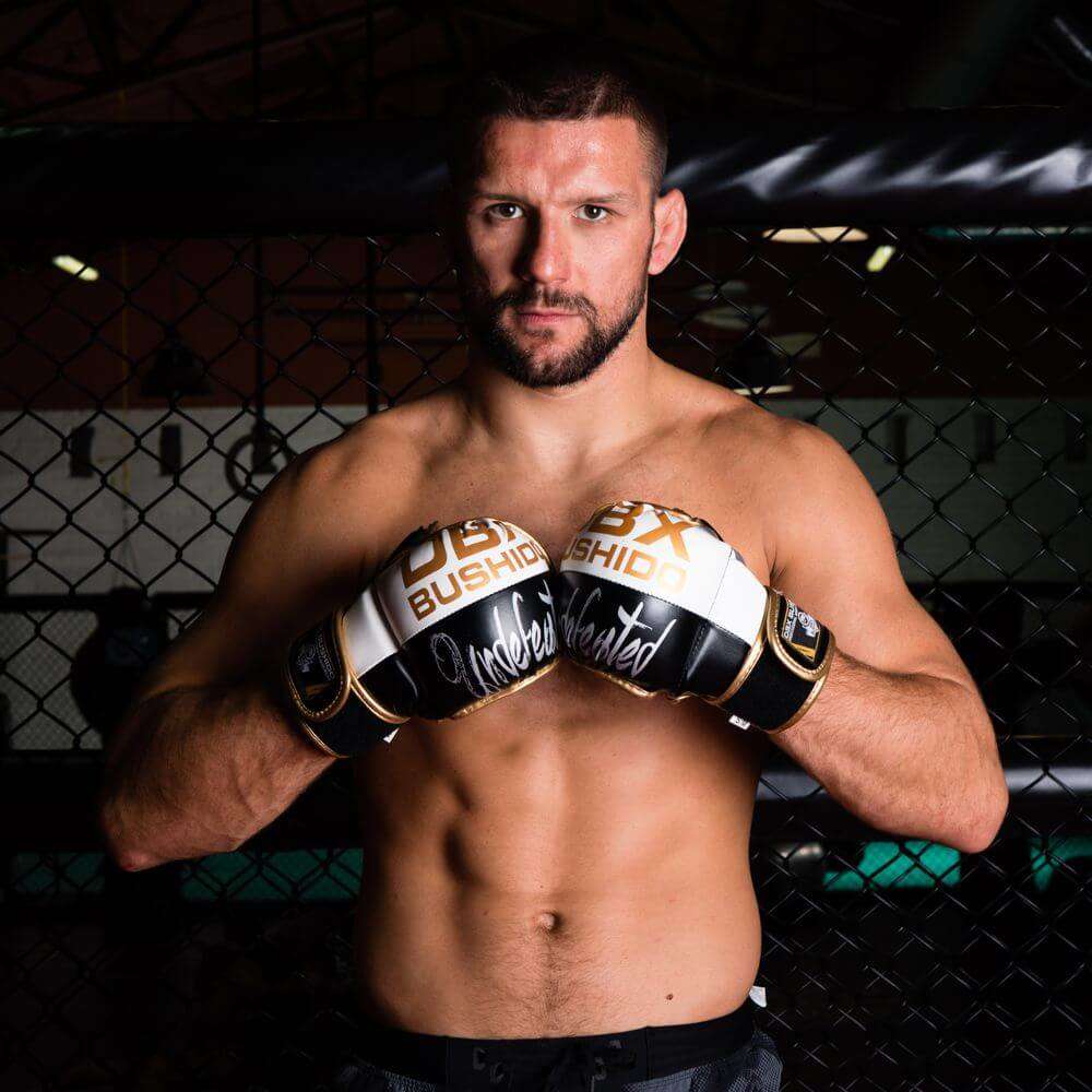 RĘKAWICE DO MMA KRAV MAGA SPARINGOWE CHWYTNE PIANKA RZEP DBX BUSHIDO L/XL Kolor dominujący czarny