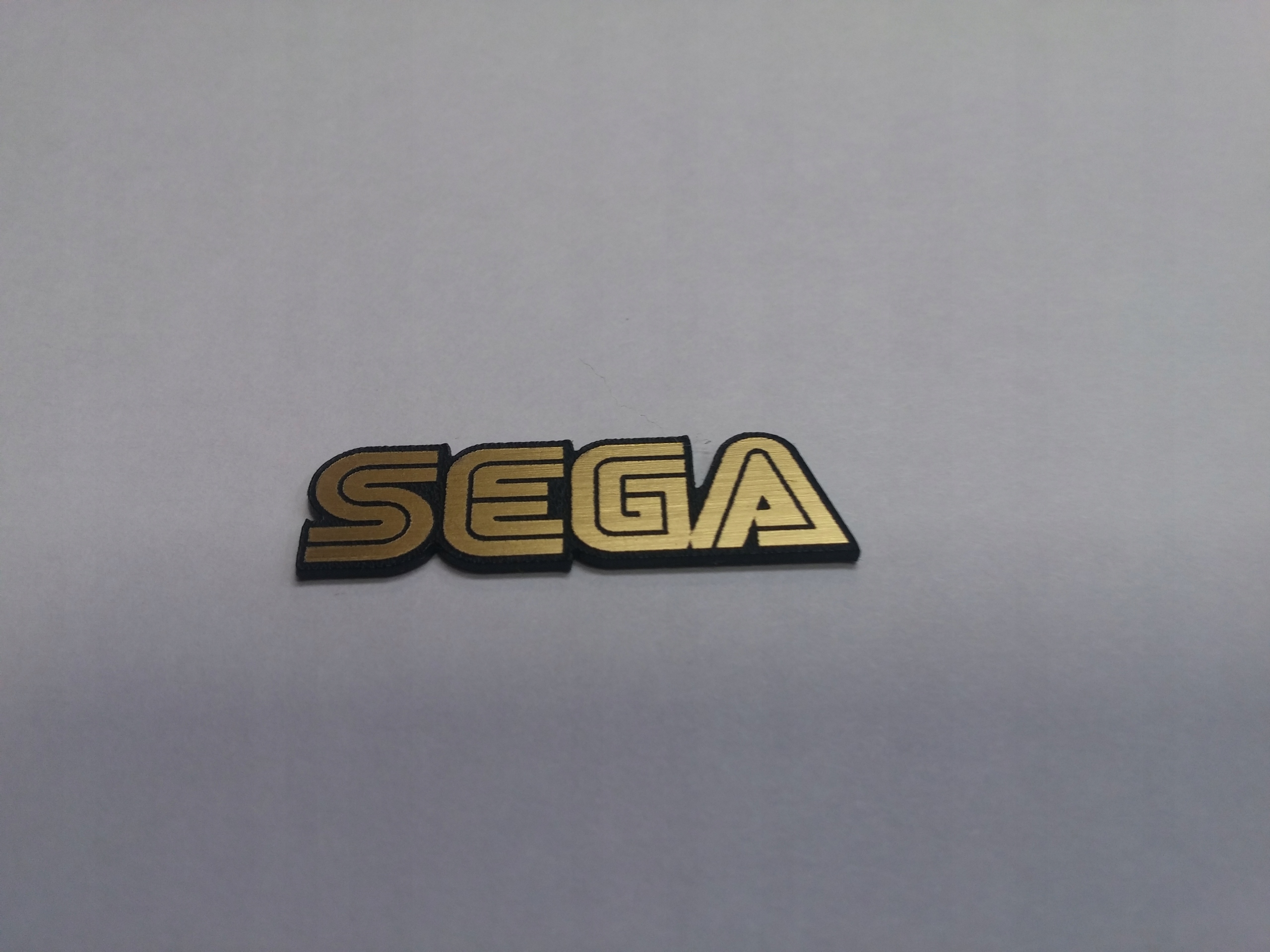 

Sega naklejka emblemat 60 x 16 mm *złota