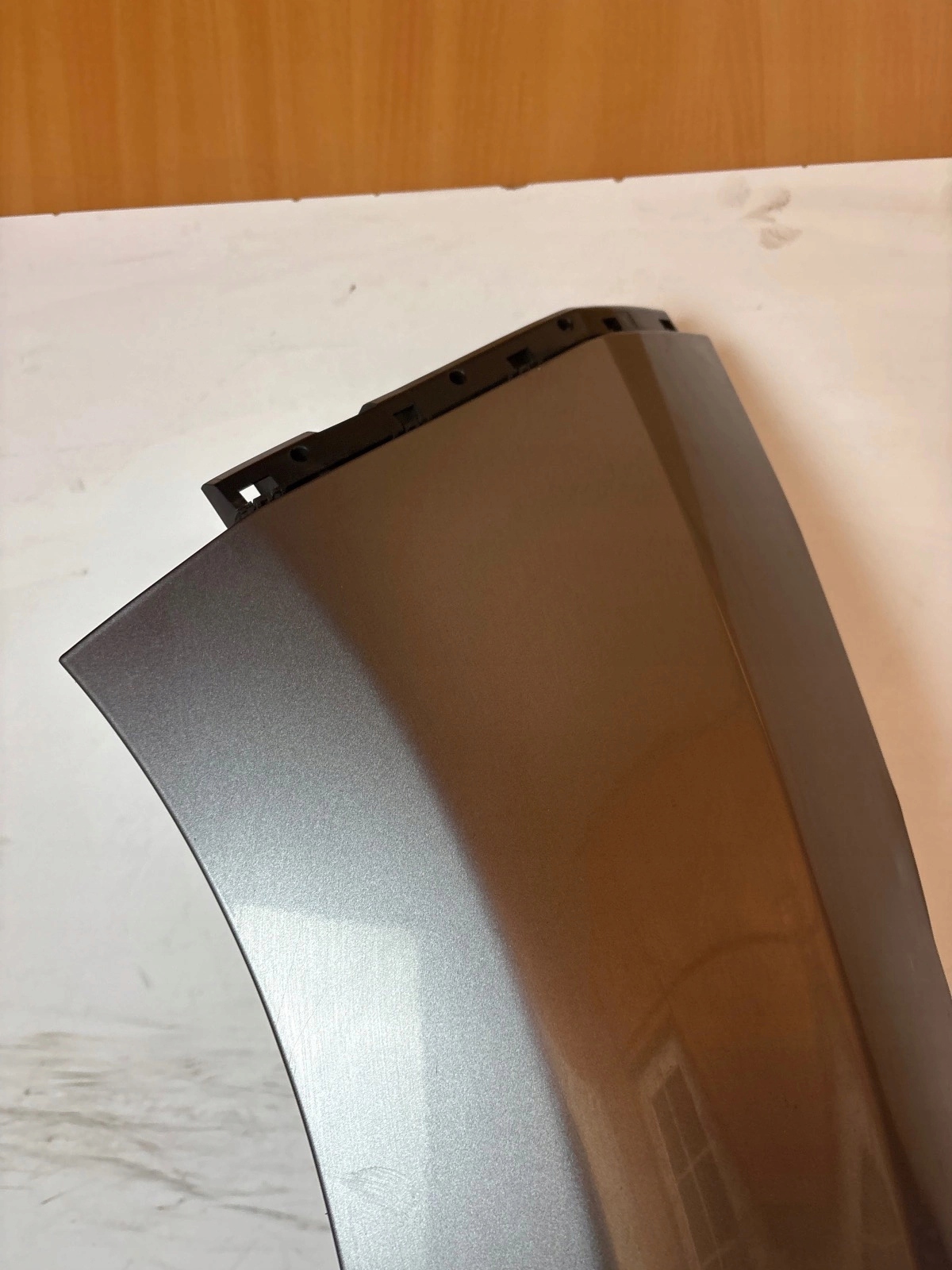 fender front front left Nissan Leaf and grey