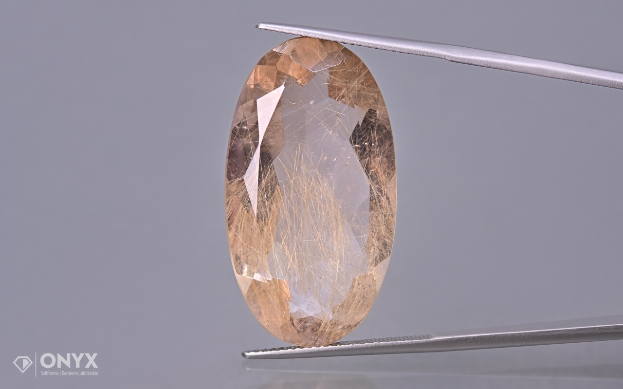 Křemen s rutilem fazetovaný ovál 32,5x18 mm