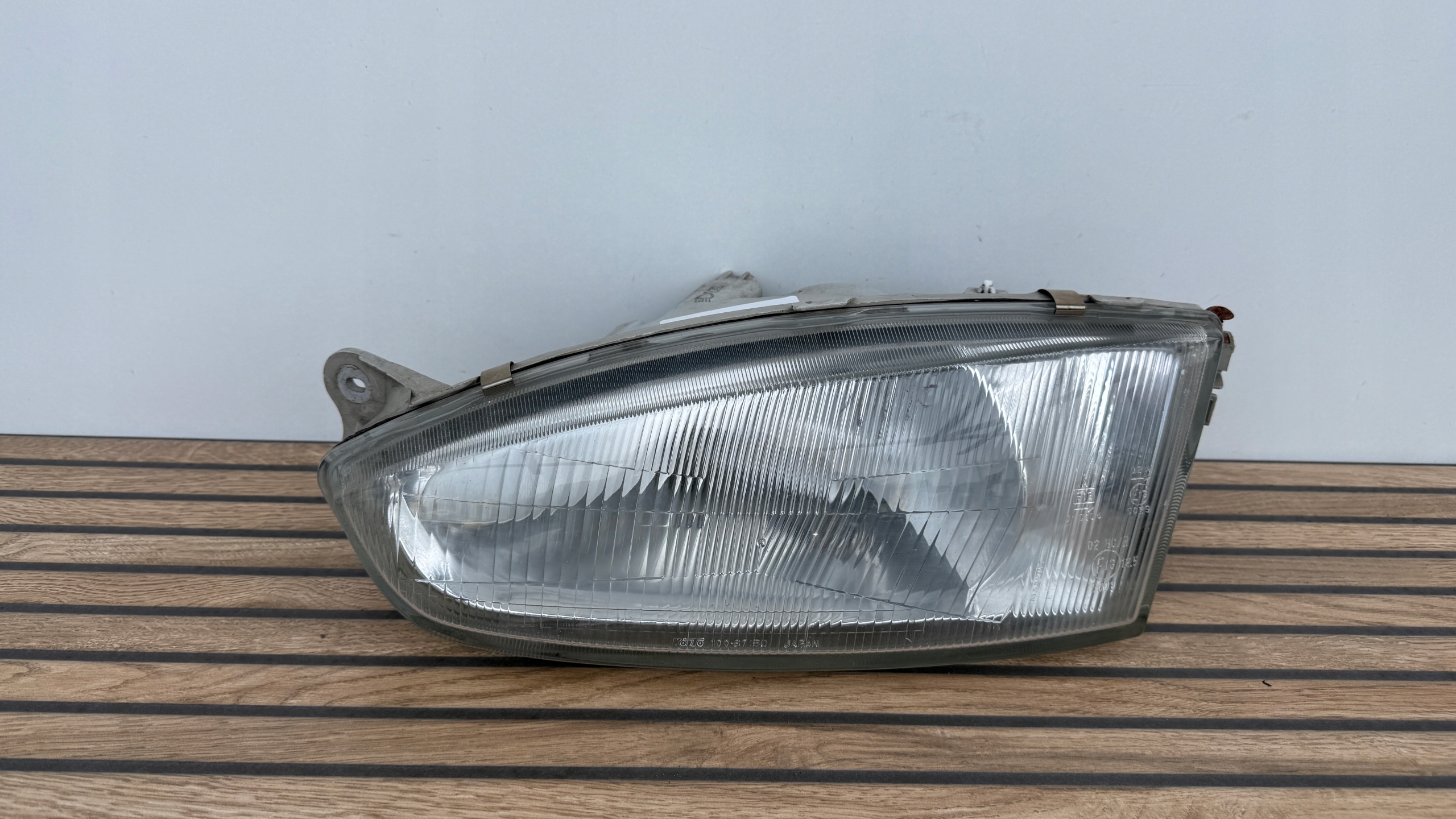 MITSUBISHI COLT 96-03 ROK left light front original 100-87148 K53/SI25