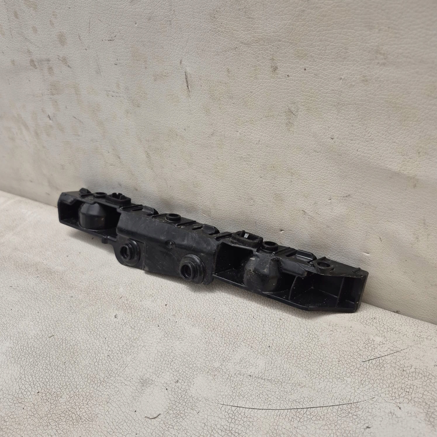 DACIA SANDERO III 3 20-> bracket holder support left rear part