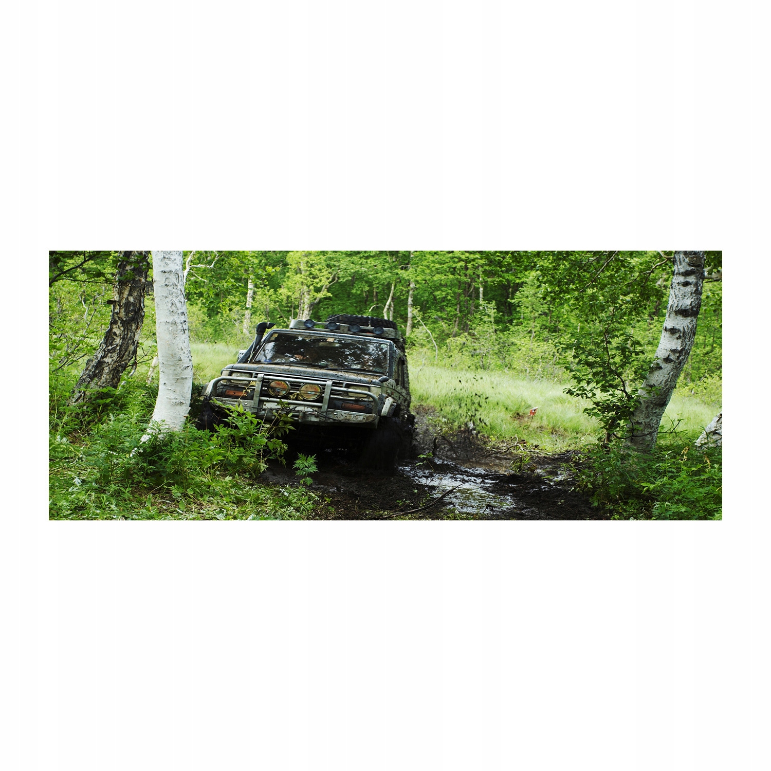 

Foto obraz akryl zdjęcie Jeep w lesie 125x50 cm
