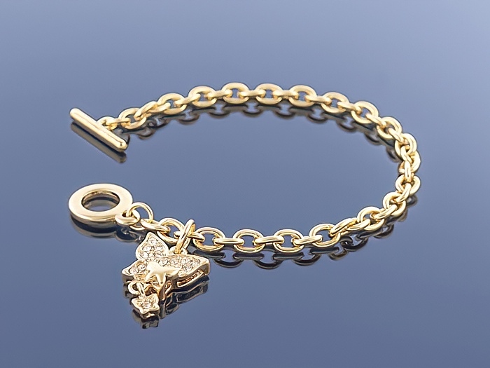 

Złota bransoletka Charms