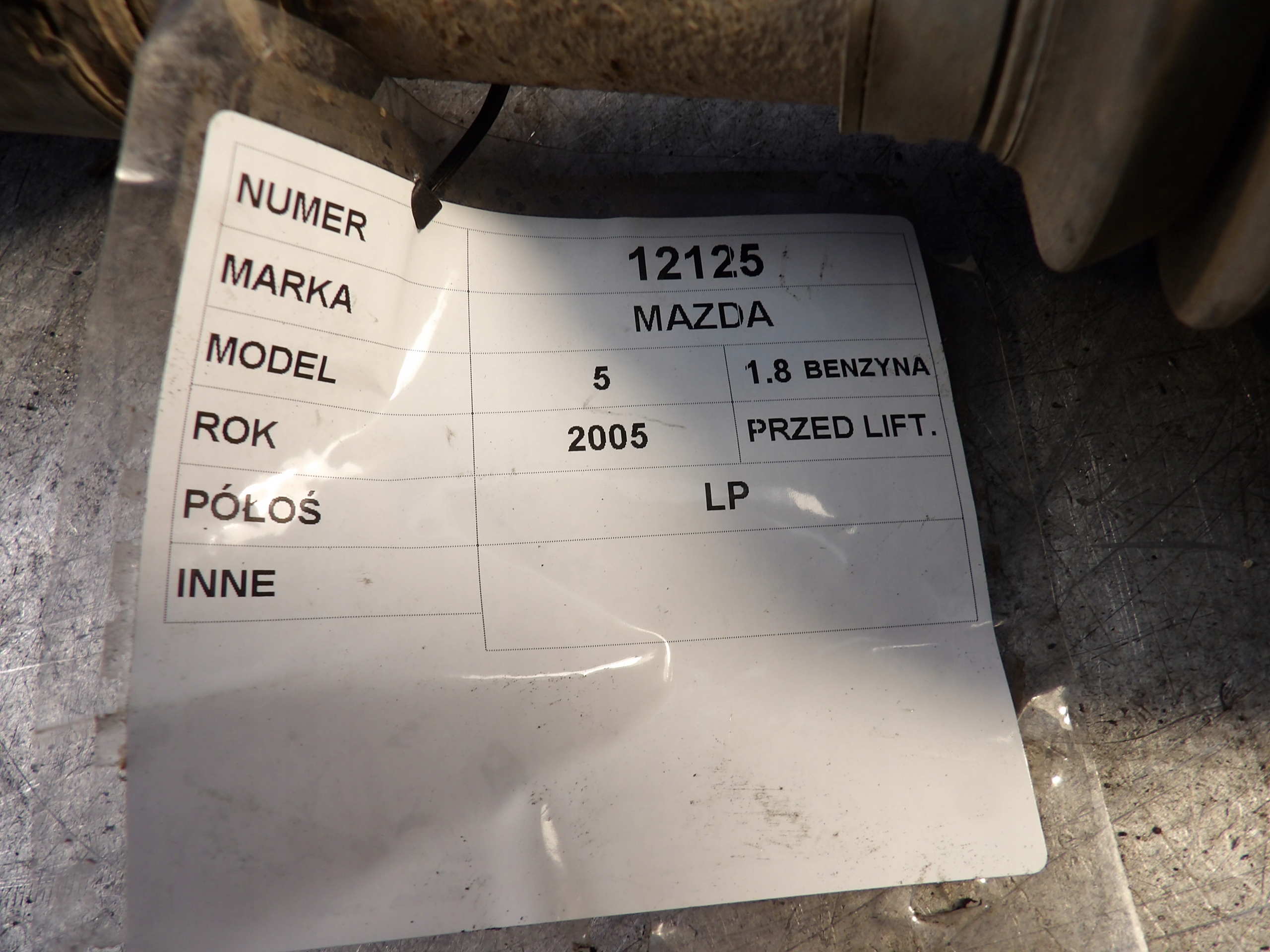Mazda V 5 semi-axis left 1,8B
