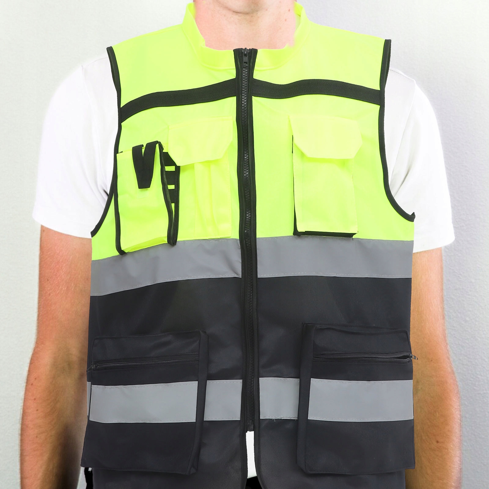 KAMIZELKA ODBLASKOWA WYSOKA WIDOCZNOŚĆ LEKKA WYGODNA Kolor dominujący odcienie zieleni