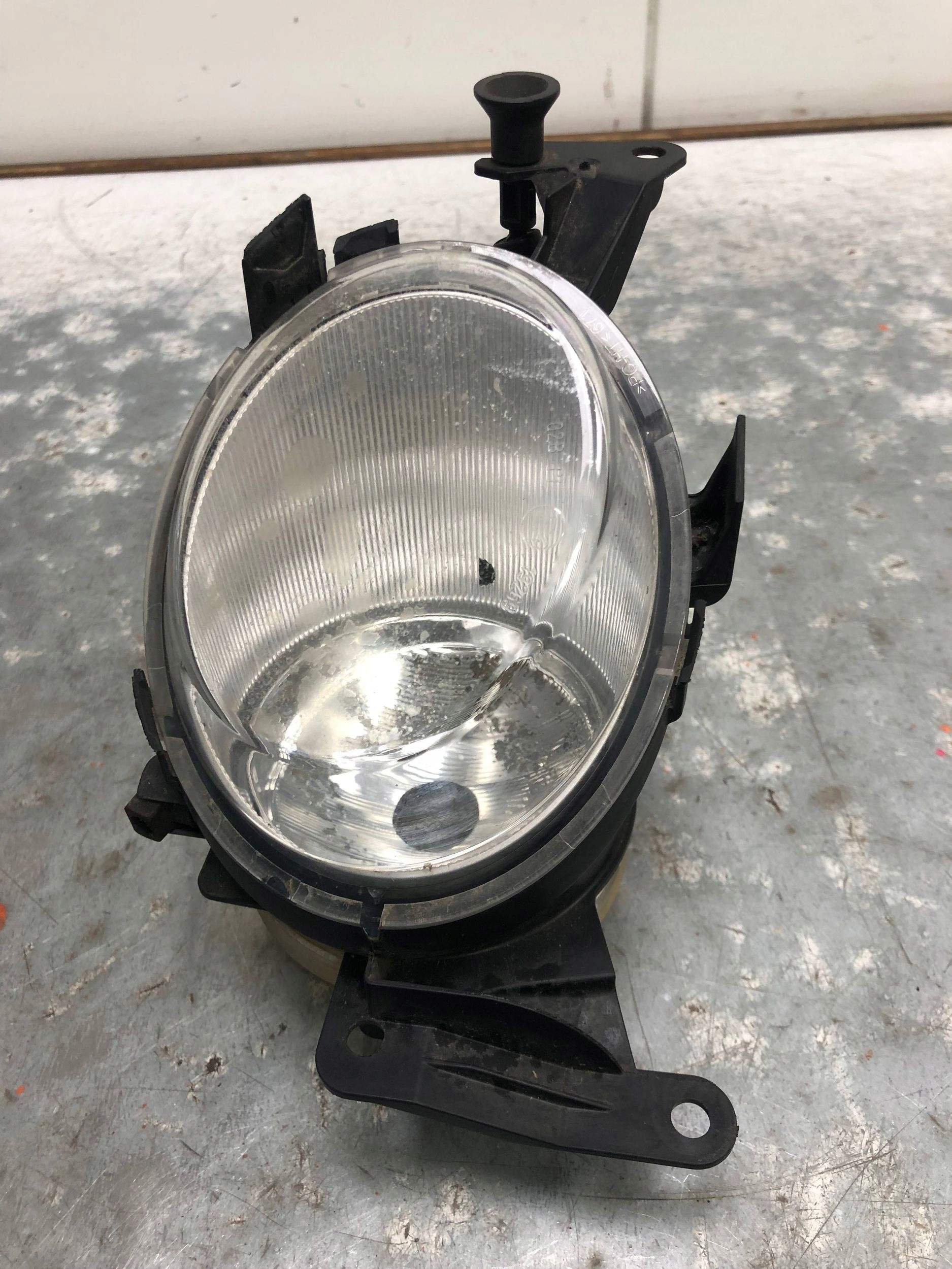 fog light left front OPEL CORSA D 13262573