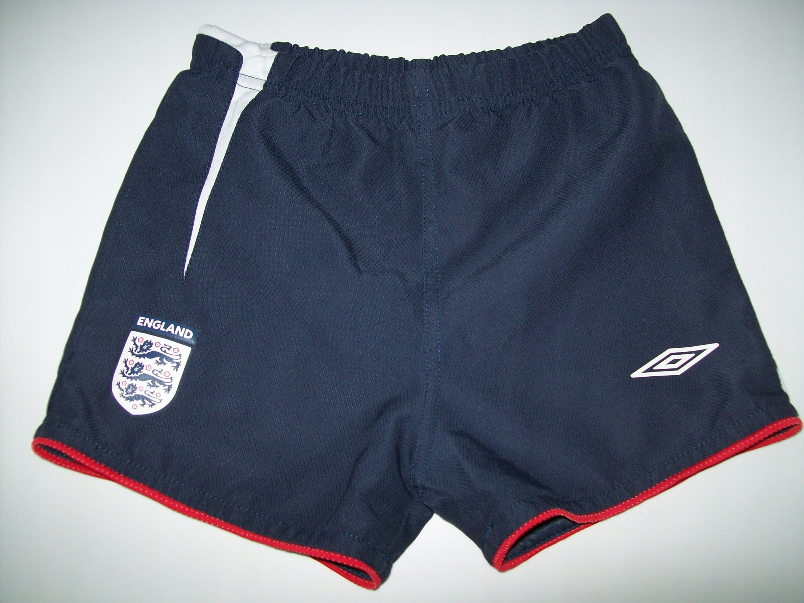 KOMPLET UMBRO ANGLIA KOSZULKA SPODENKI 110 CM. Drużyna inna