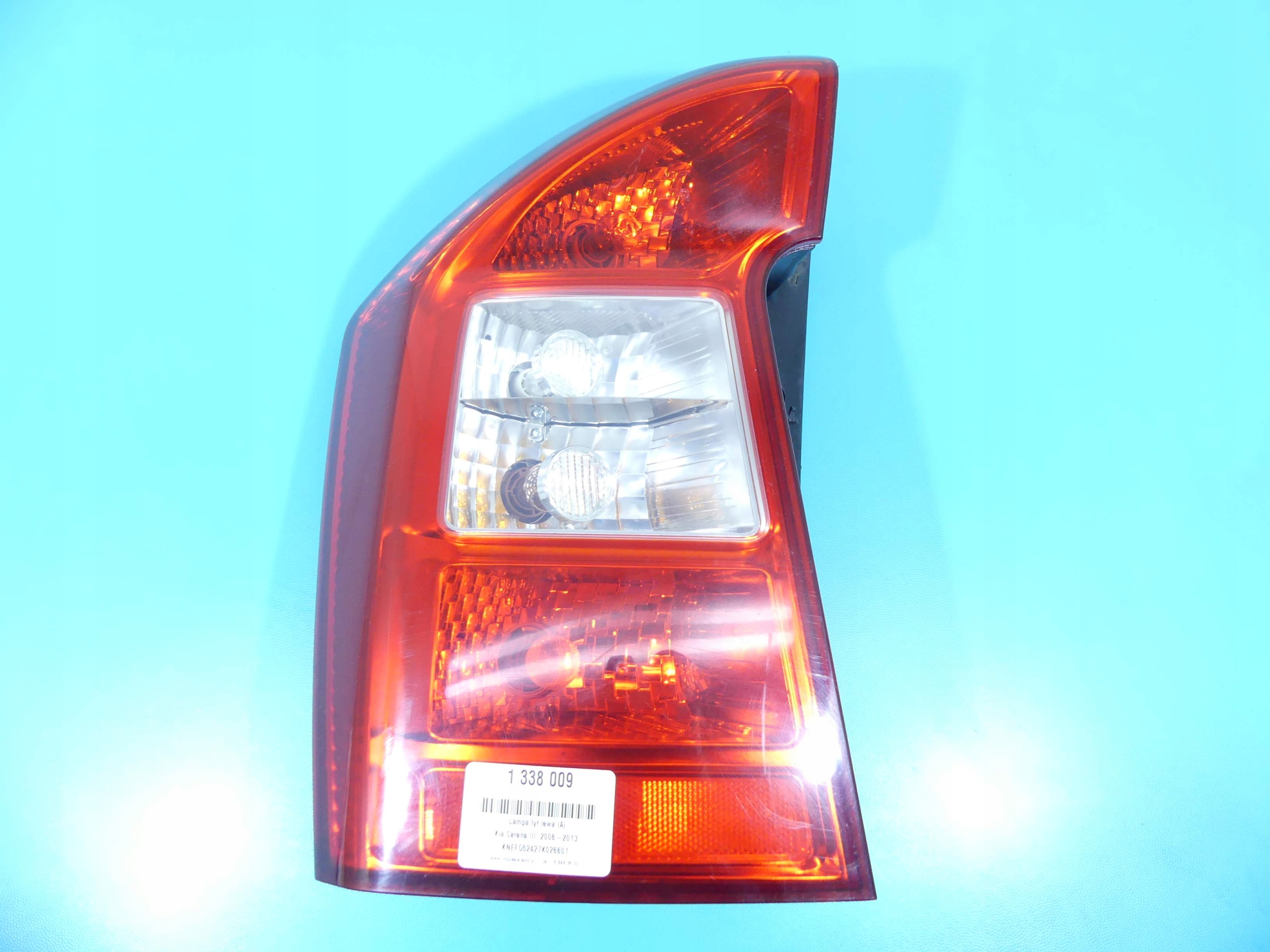 фонарь левый kia CARENS III 06-13 HB