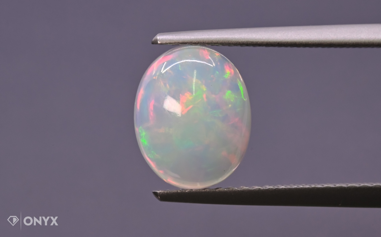 Opál z Etiopie kabošon ovál 10x8 mm