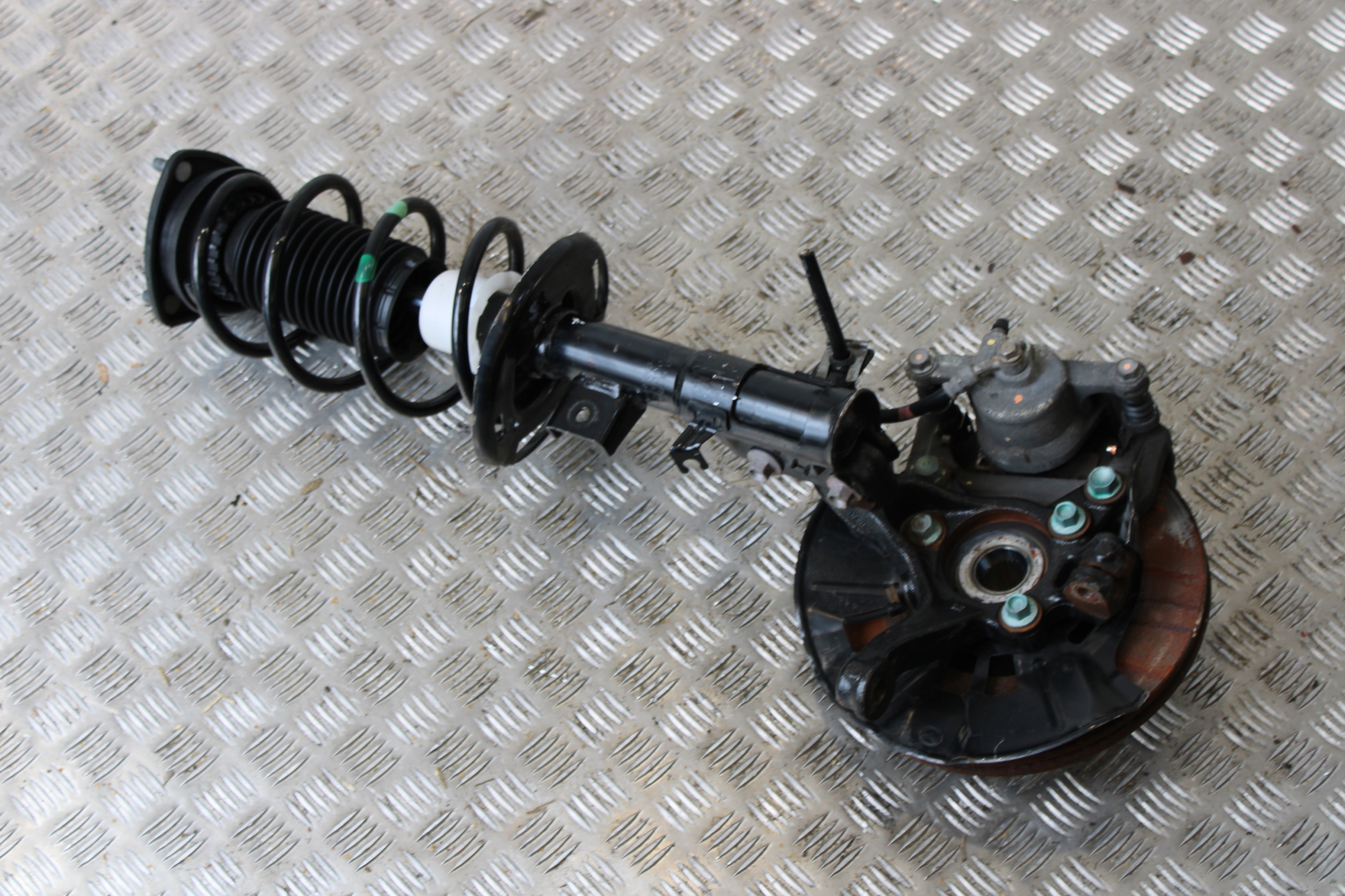 swing shock absorber left front MAZDA 2 II DJ LIFT