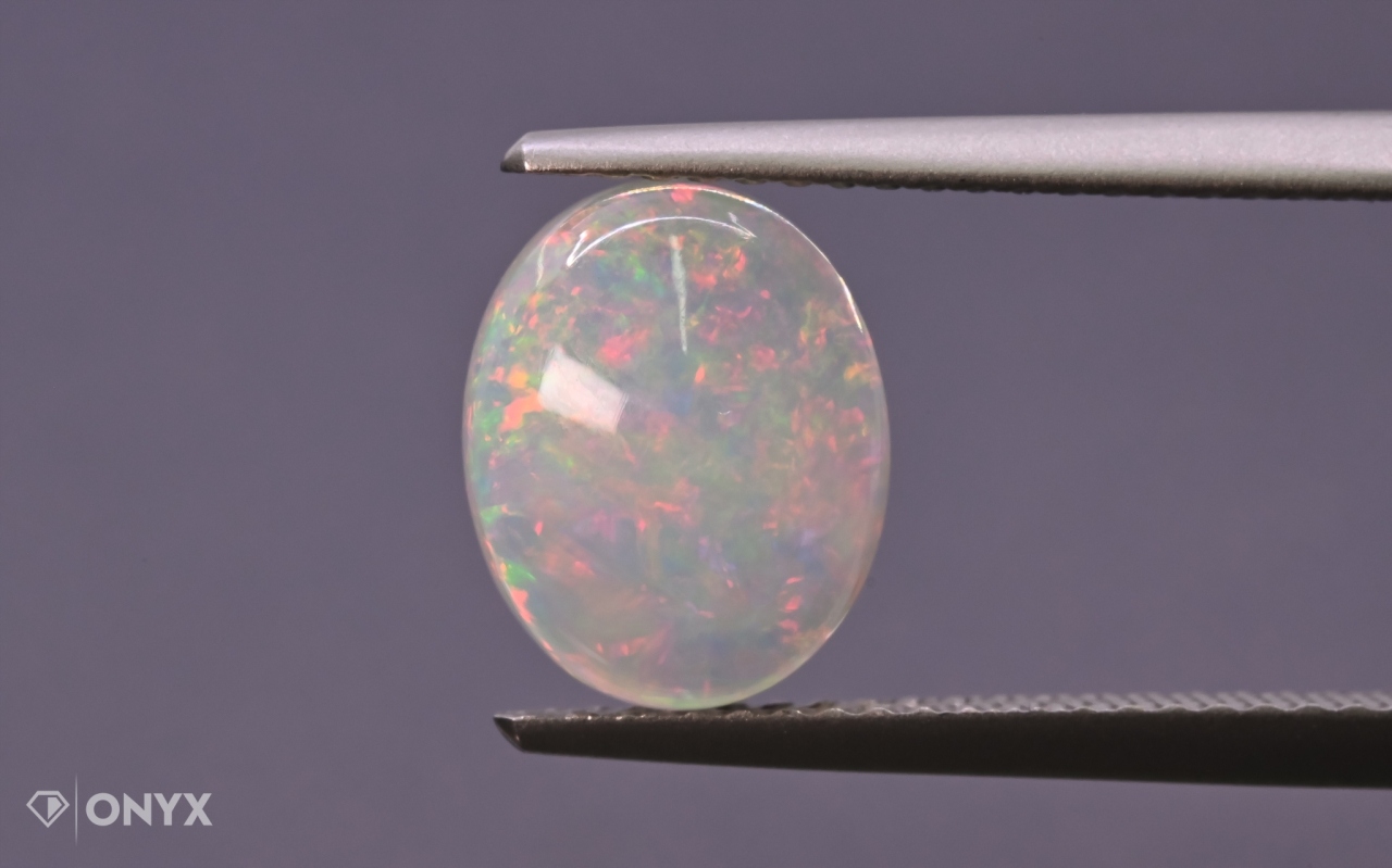 Opál z Etiopie kabošon ovál 10x8 mm