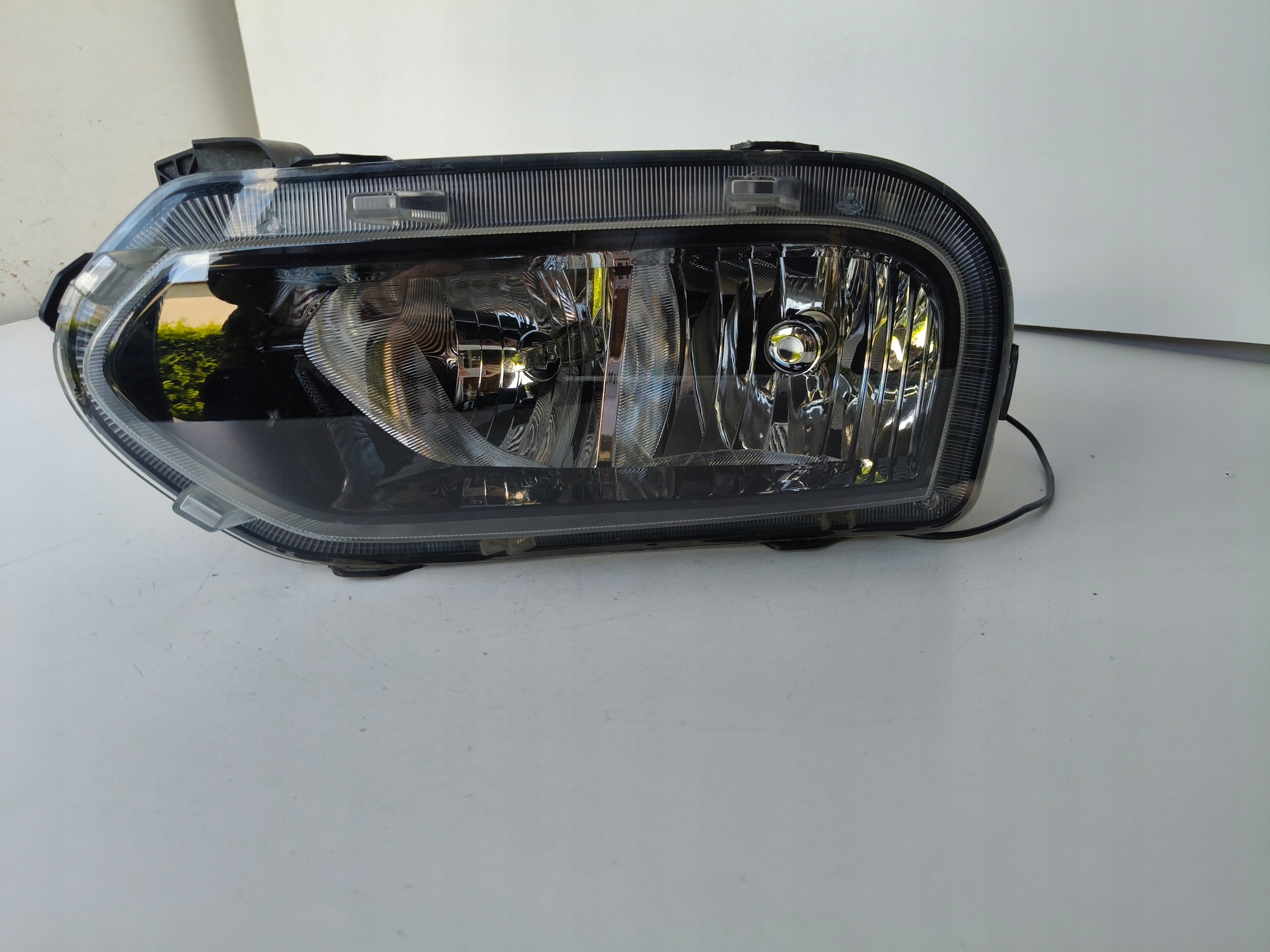 light left REFLEKTOR DACIA SPRING 21