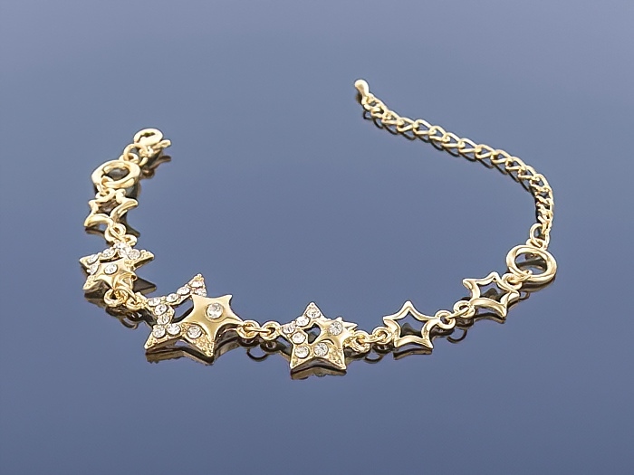 

Złota bransoletka Charms