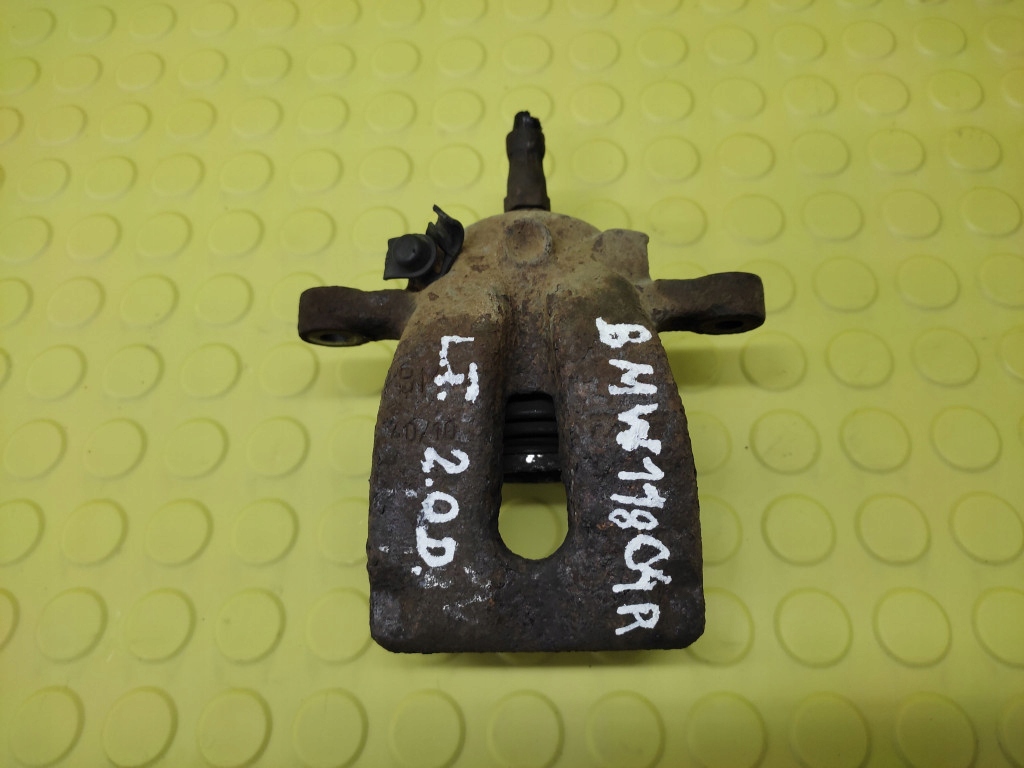BMW 1 E87 2.0 D caliper left rear part