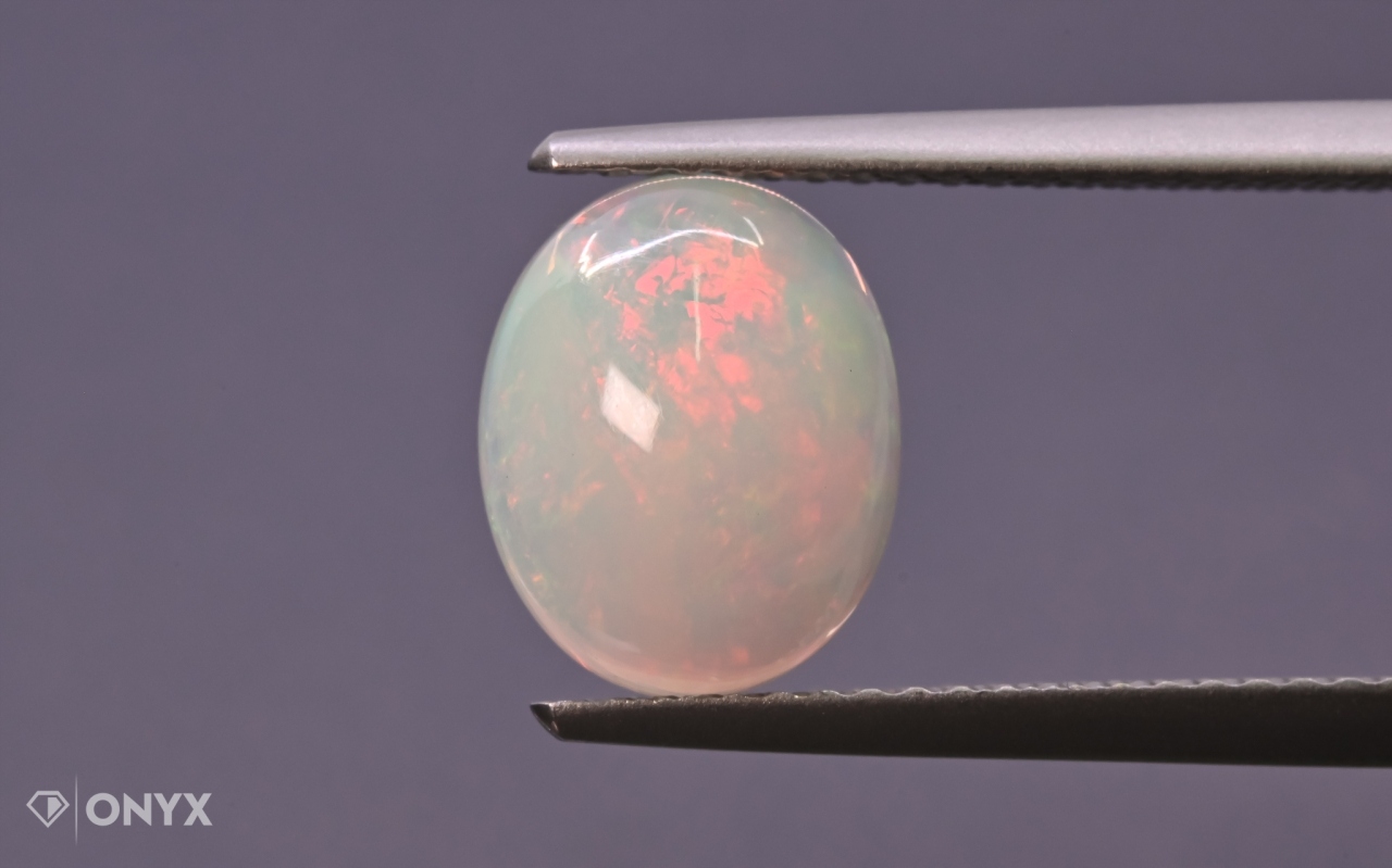 Opál z Etiopie kabošon ovál 10x8 mm