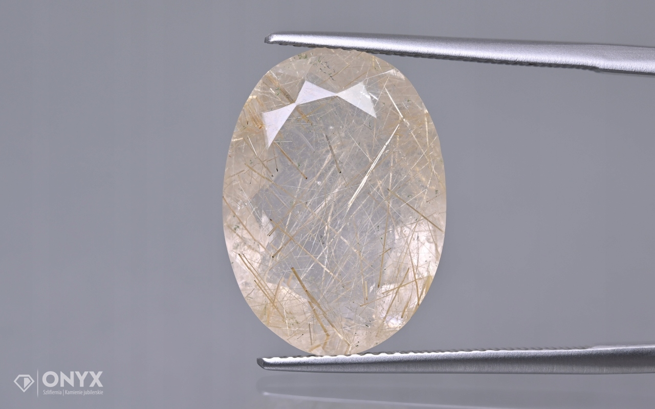 Křemen s rutilem fazetovaný ovál 19x13,5 mm