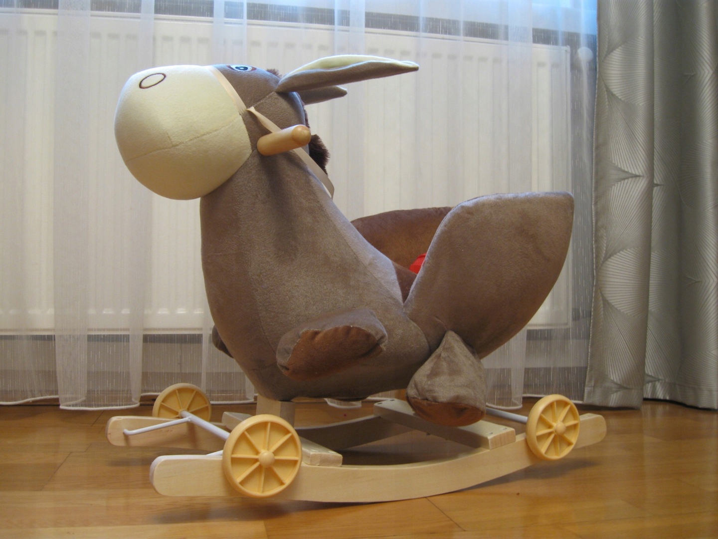 ŚPIEWAJĄCY BUJAK na BIEGUNACH PŁOZACH i KÓŁKACH 3w1 OSIOŁEK GRA MELODIE Materiał drewno tkanina