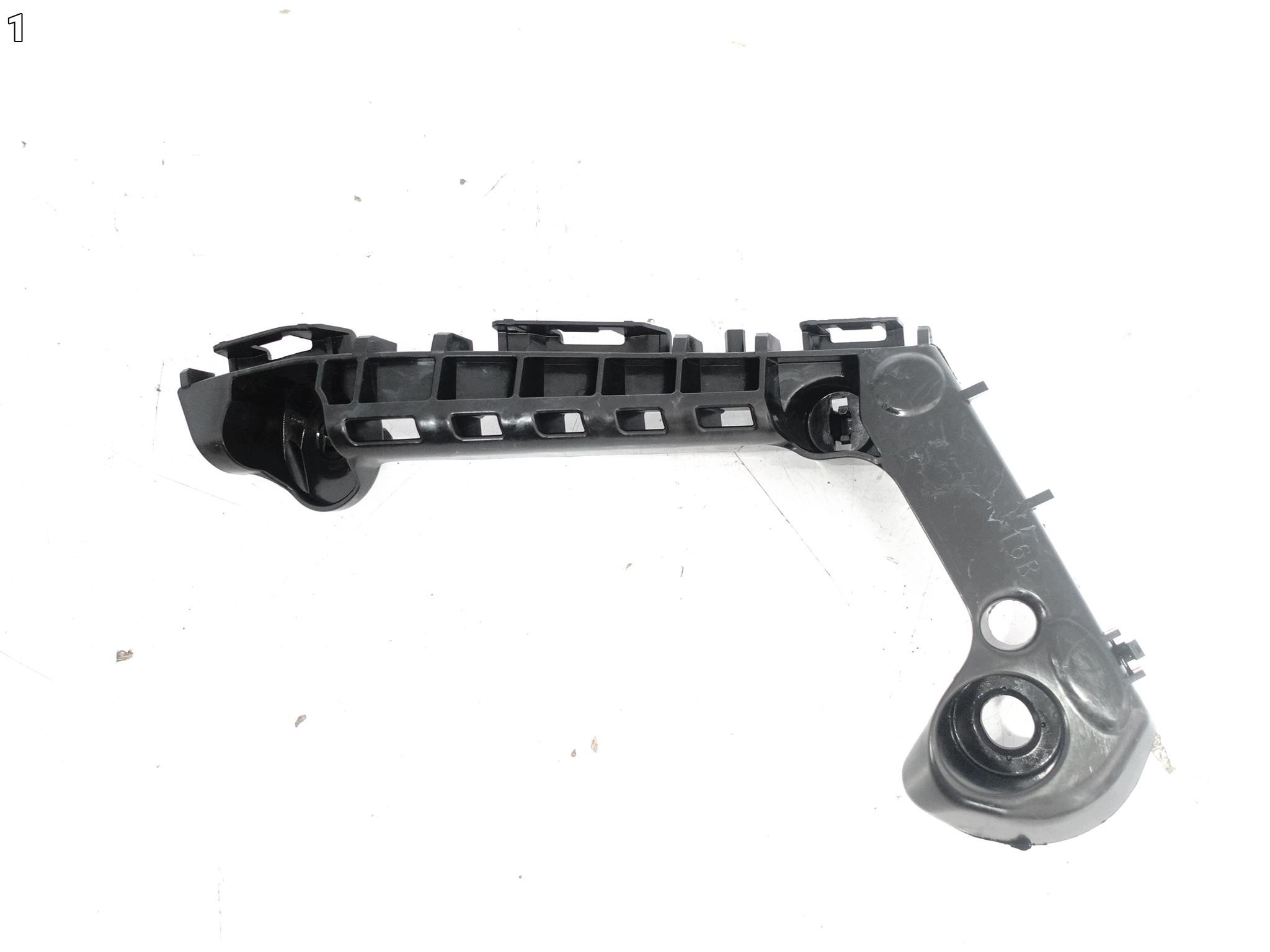 TOYOTA COROLLA E21 XII 18- support holder W bumper front right ORG
