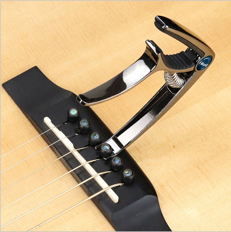 Kapodaster do gitary METALOWY SREBRNY capo NAJWYŻSZA JAKOŚĆ | MuziK Waga produktu z opakowaniem jednostkowym 0.1 kg