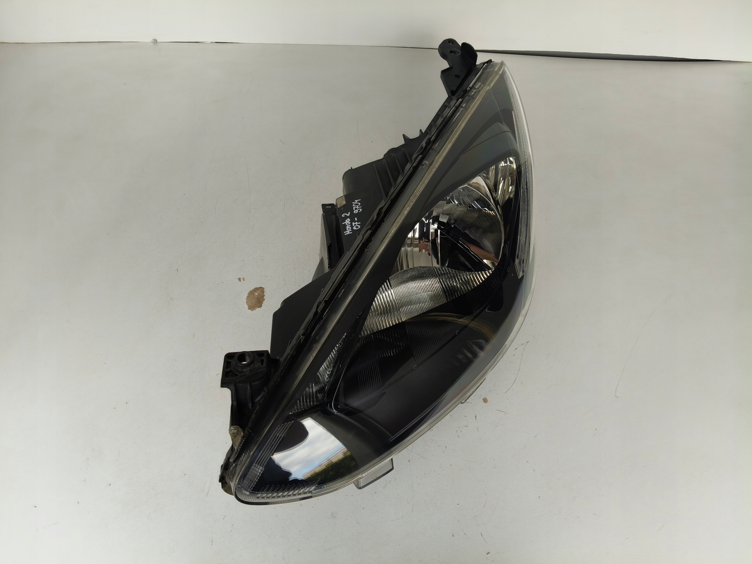 light left REFLEKTOR MAZDA 2 07