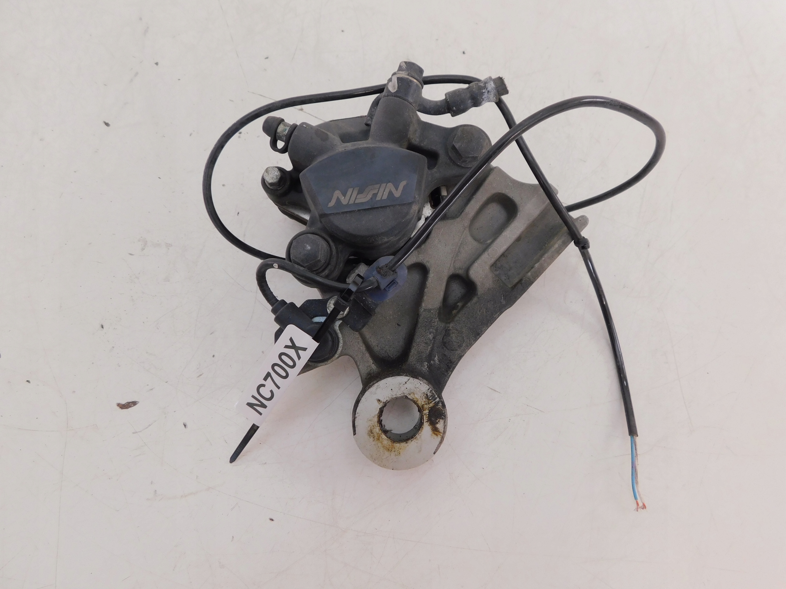 HONDA NC 700X ЗАДНІЙ ГАЛЬМІВНИЙ СУПОРТ + ДАТЧИК ABS