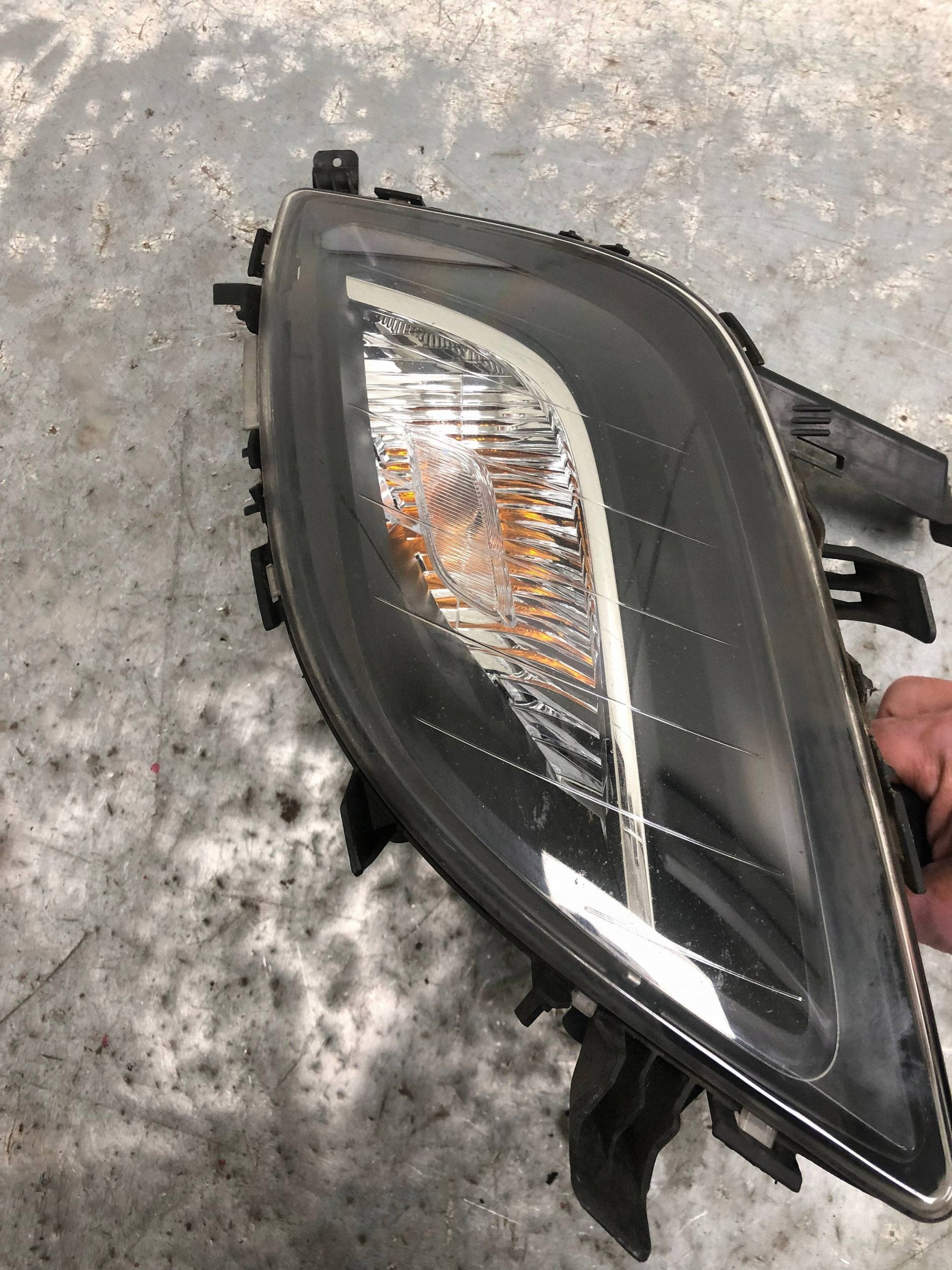 fog light left front OPEL ASTRA J KOMBI 13264641