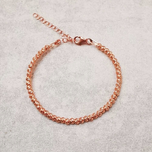 Náramek z kuliček pozlaceného do růžova stříbra