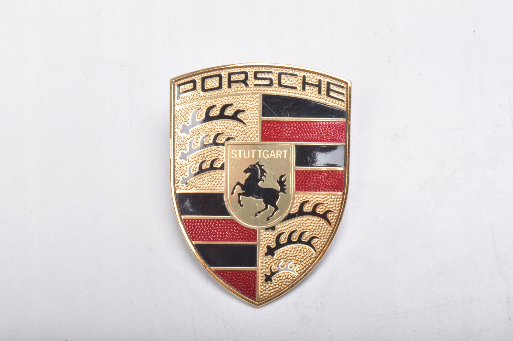 PORSCHE MACAN ZNACZEK LOGO EMBLEMAT PRZÓD 99155921100 Jakość części (zgodnie z GVO) O - oryginał z logo producenta pojazdu (OE)