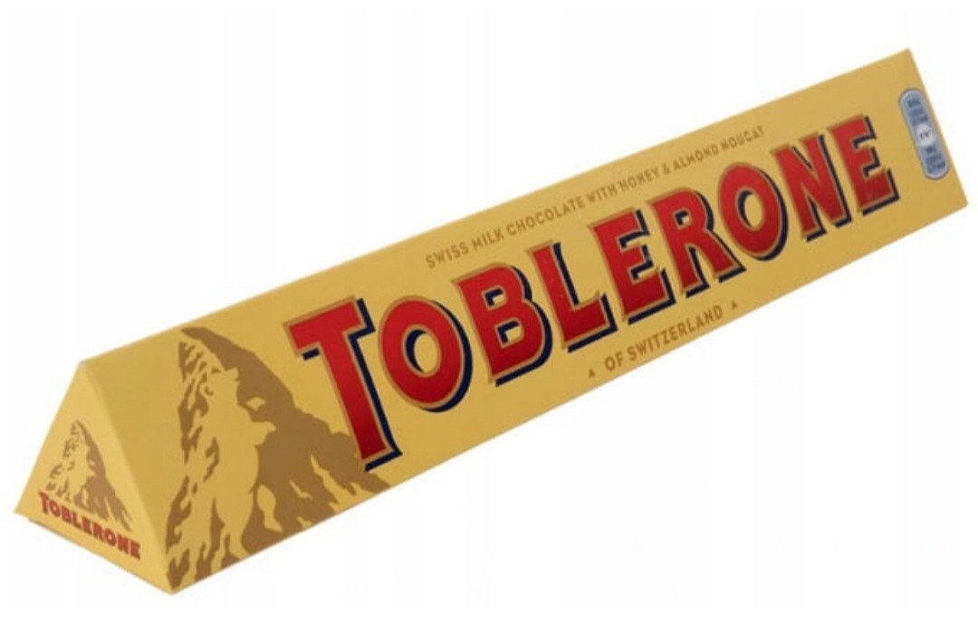 Toblerone Czekolada mleczna nadziewana nugatem z miodem i migdałami 100 g
