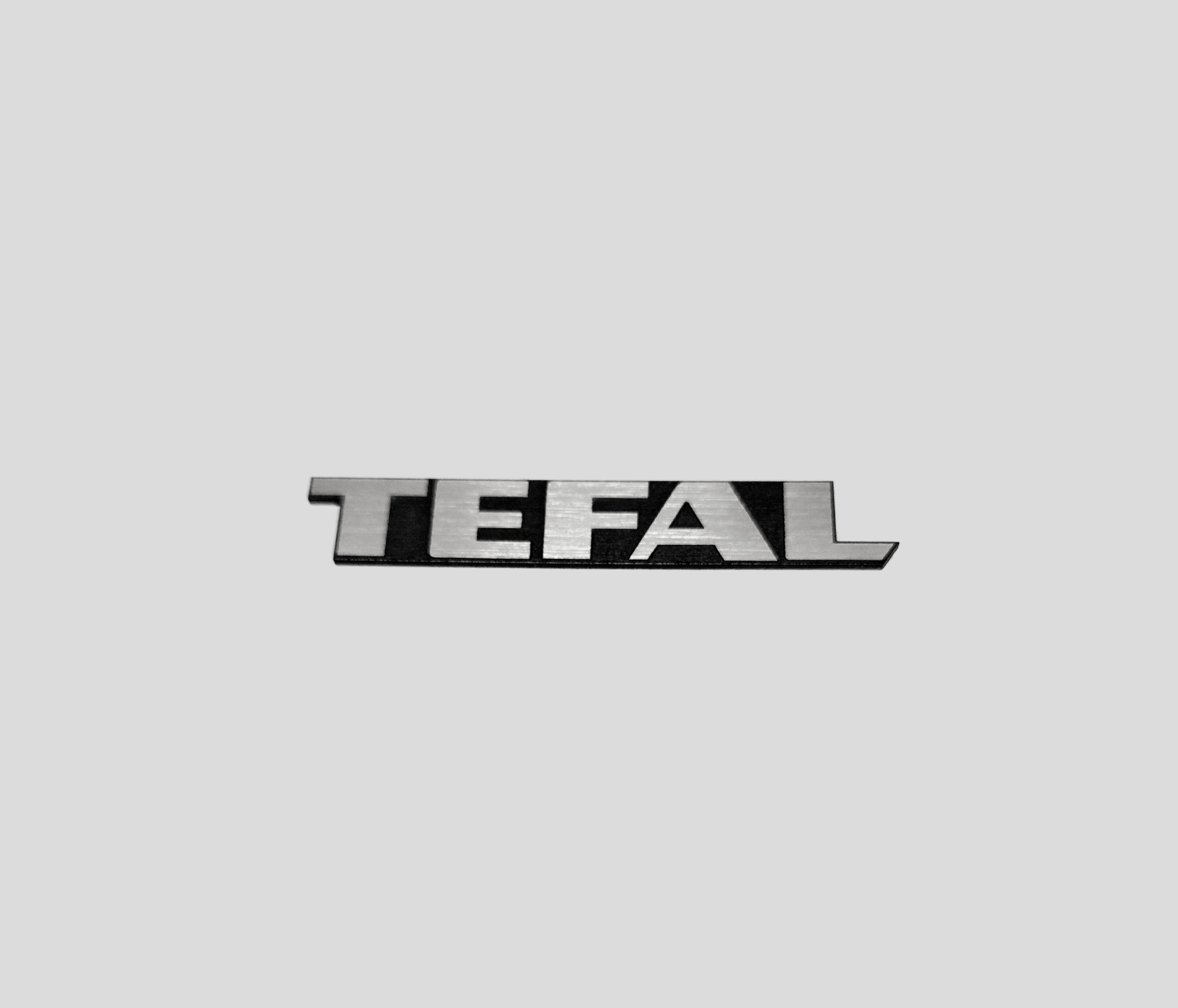 

Tefal naklejka emblemat 30 x 5 mm *srebrna