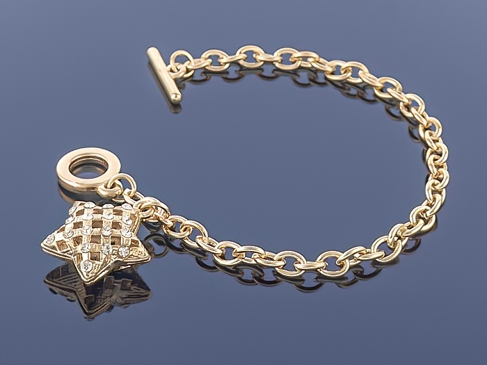 

Złota bransoletka Charms