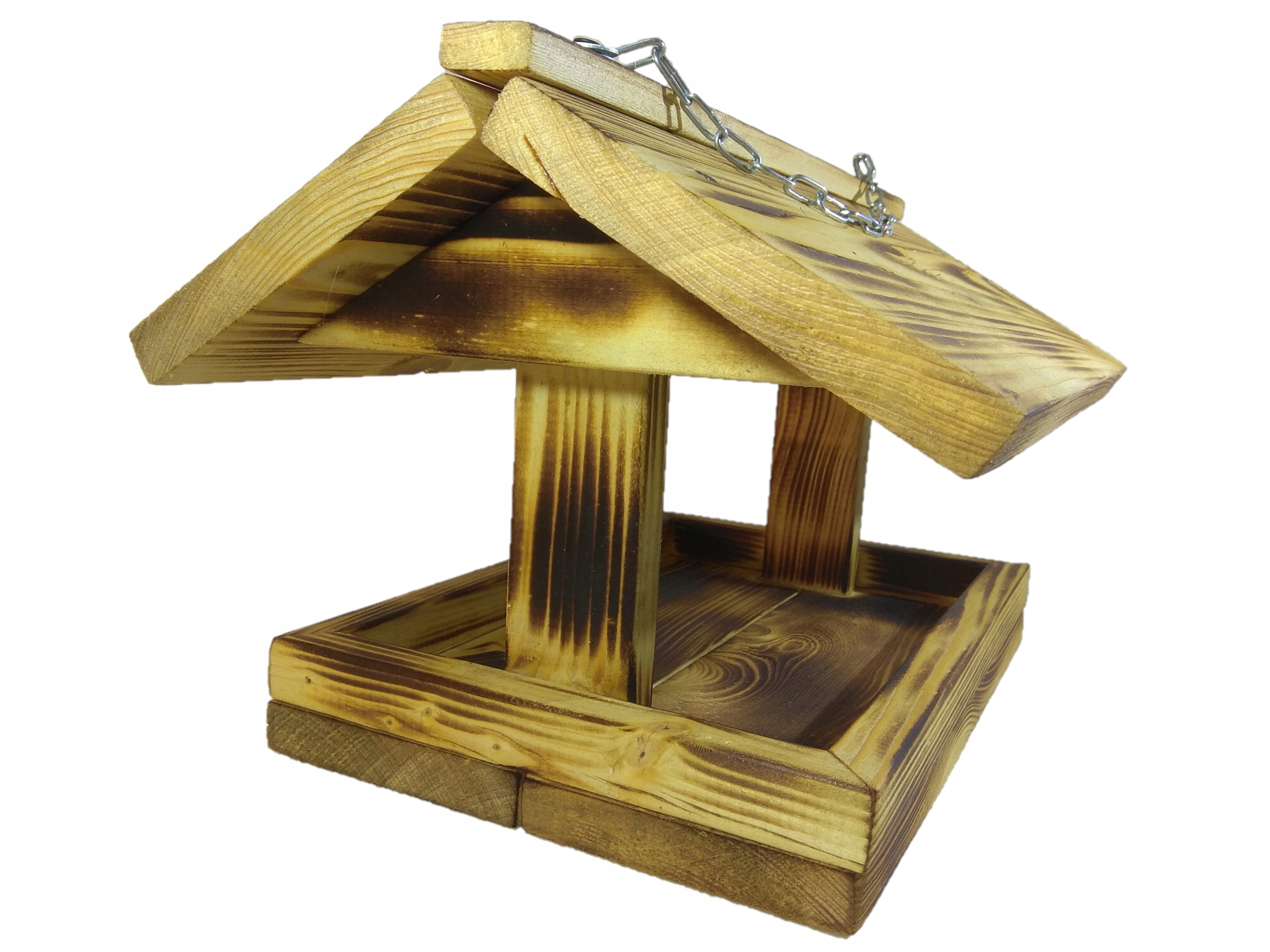 

Duży, drewniany karmnik dla ptaków. Opalany